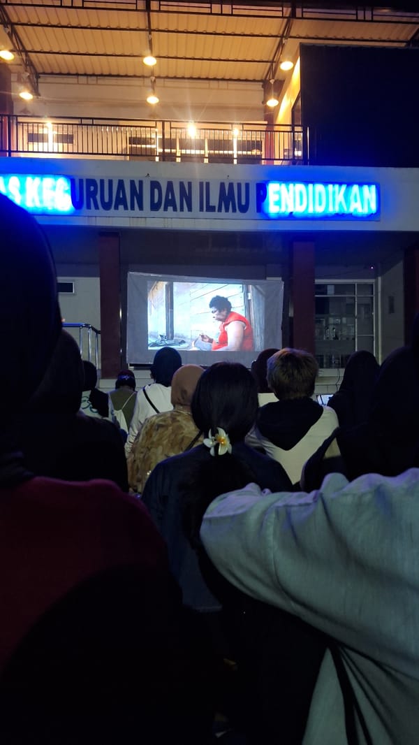 Outdoor movie screening draws crowd in Sukaharja, Indonesia