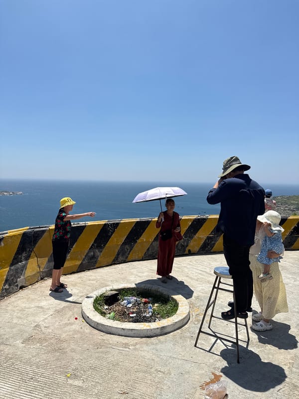 Family visits coastal overlook in Vinh Hai, Vietnam