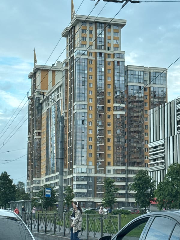 Saint Petersburg cityscape mixing modern towers and Orthodox church