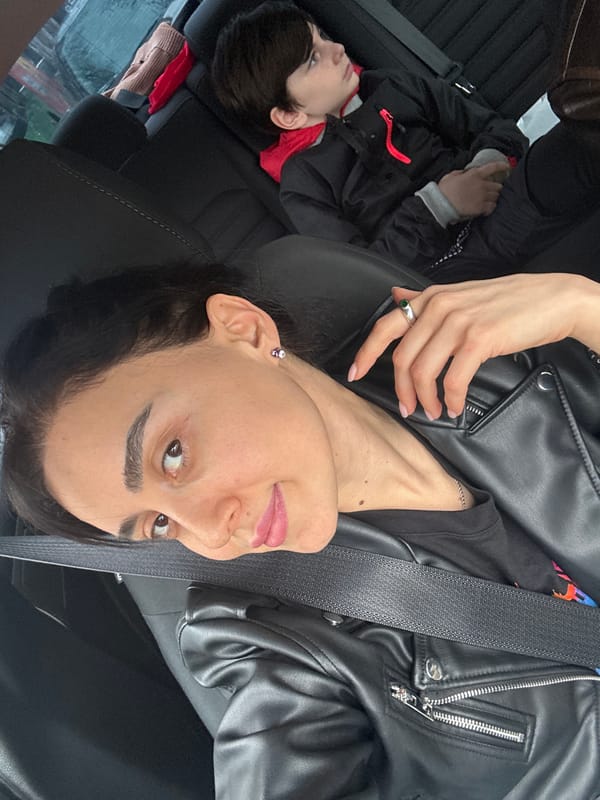 Woman and child travel by car in Tbilisi