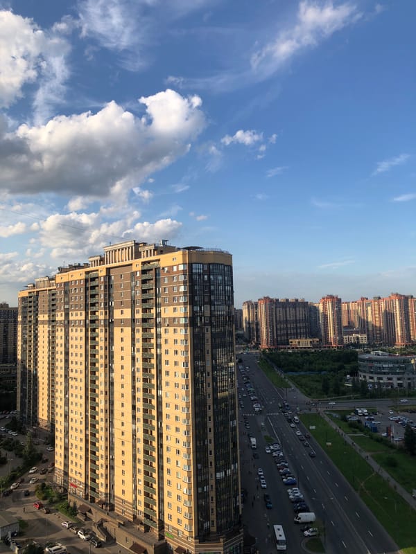 Drone survey of a dense city: towers, roads, and industrial edges