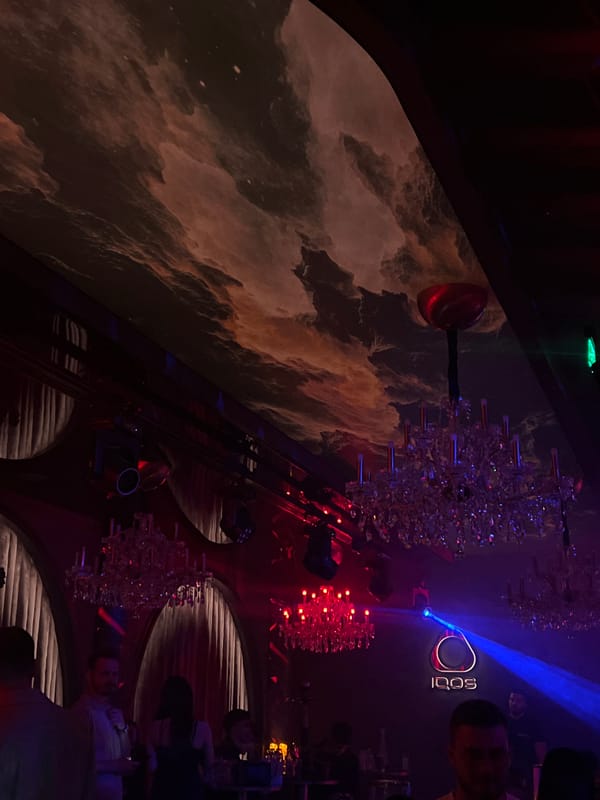 Nightclub interior with cloudscape mural documented in Plovdiv