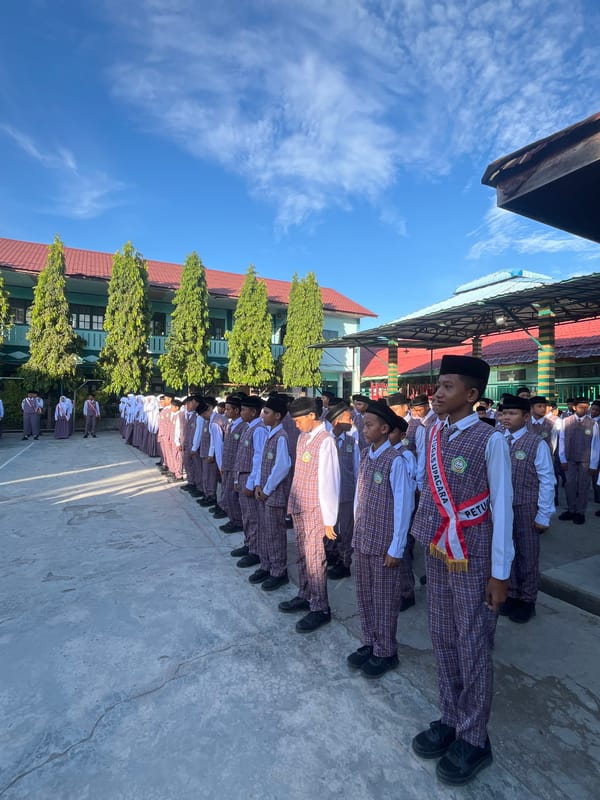 School assembly in formation at a Lhokseumawe schoolyard