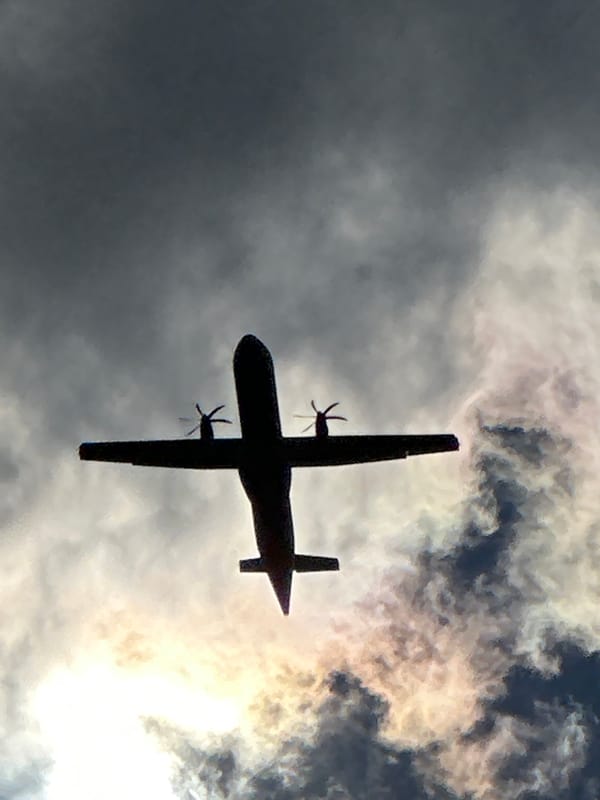 Twin-engine turboprop tracked across a stormy sky