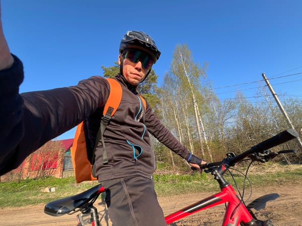 Cyclist takes selfie on dirt road in Chaikovsky