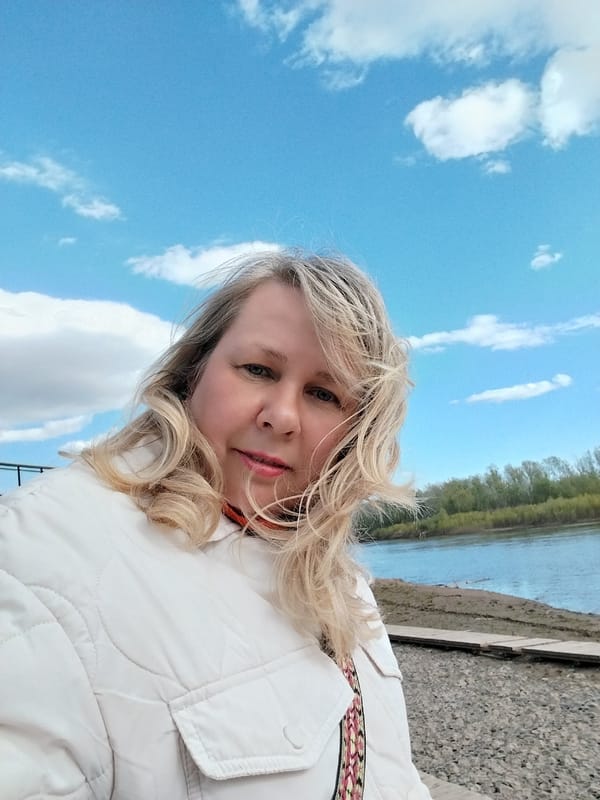 Woman documents riverside outing in Orenburg, Russia with selfies