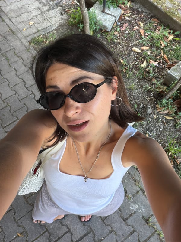 Woman poses for selfies among pink hydrangeas in Budva