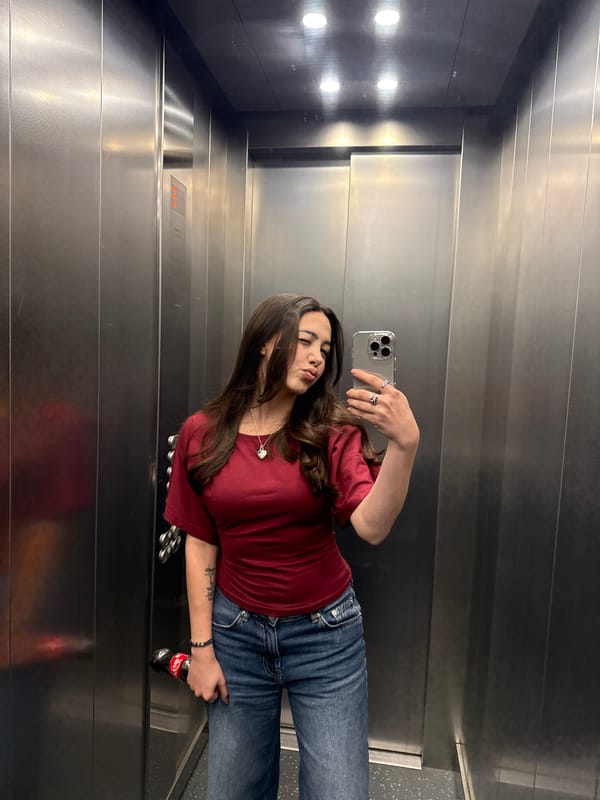 Woman takes elevator selfie with Coca-Cola in Yerevan