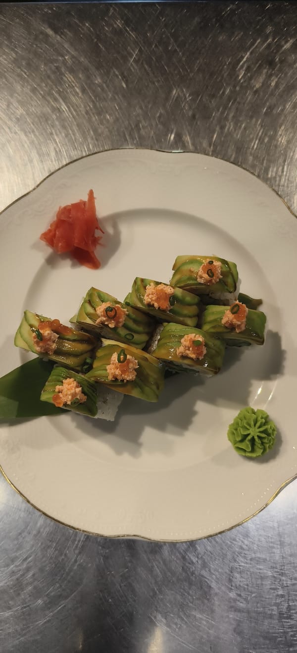 Sushi plate with eight rolls observed at dining location