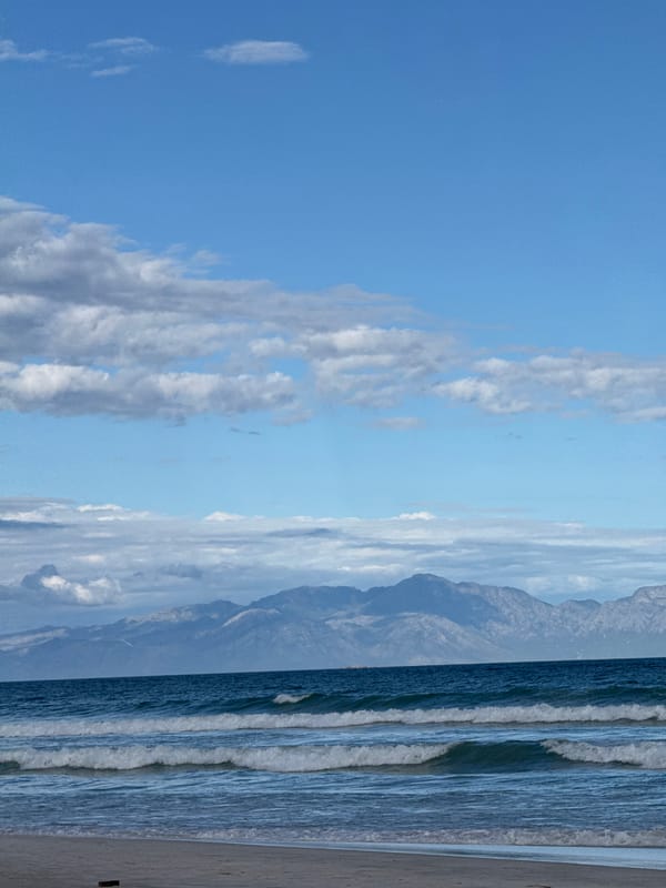 Ordinary afternoon unfolds at Muizenberg Beach, Cape Town