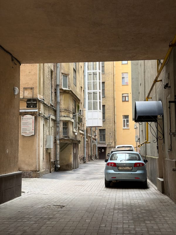 Courtyard scenes documented in Saint Petersburg featuring gated alleyway