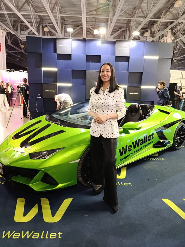 Woman poses with green Lamborghini sports car