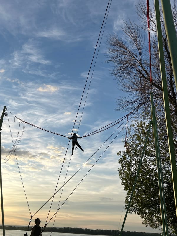 Bungee trampoline fun at sunset on the Novokuybyshevsk embankment