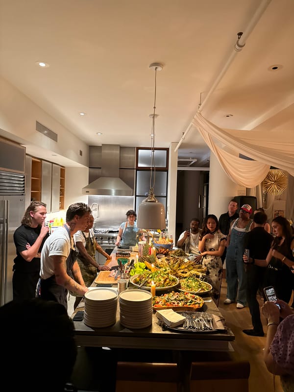 Late-night kitchen gathering features food preparation in NYC