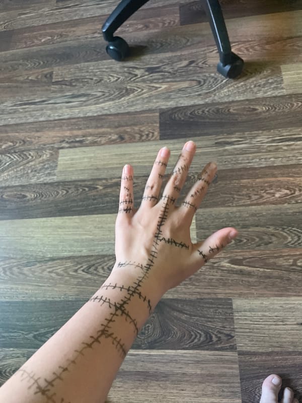Person documents elaborate stitch-pattern body art in Sayanogorsk, Russia
