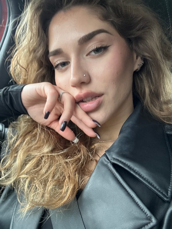 Woman takes selfie in vehicle in Bulgarian village