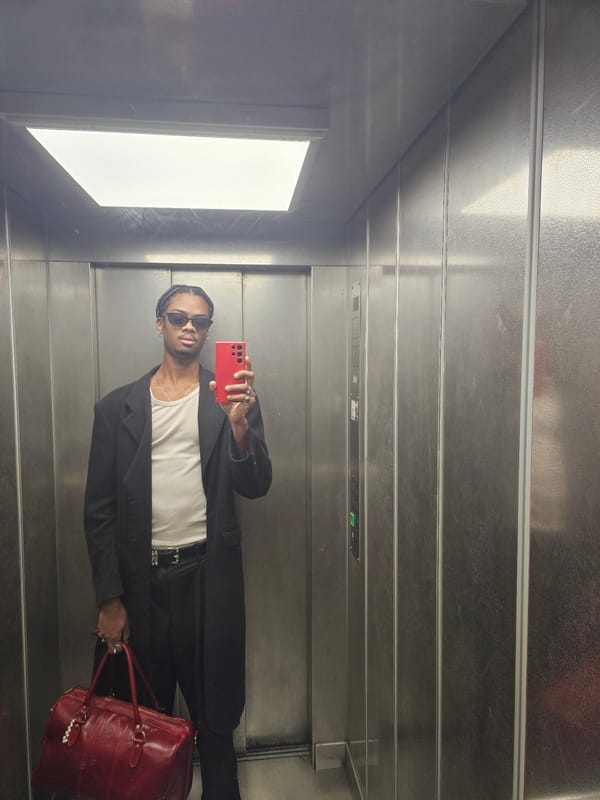 Person with red phone moves through Pantin elevator, streets