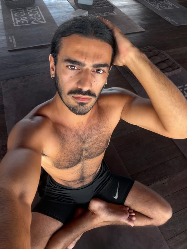 Yoga session in a Mengwi studio, rooftops in the background