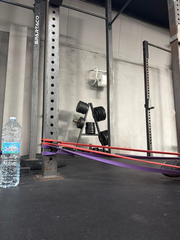 Gym interior documented in Lecce, Italy showing equipment and branding
