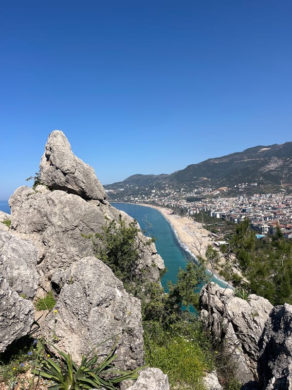 Tourist captures scenic coastal views from Alanya clifftop overlook