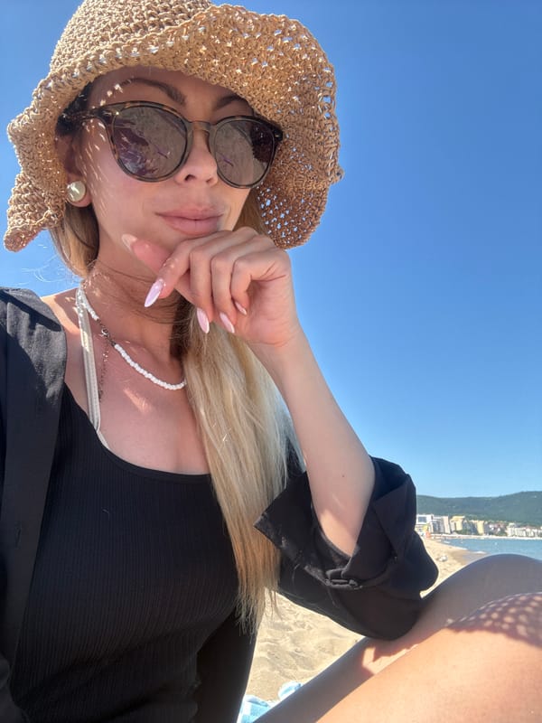Woman enjoys sunny beach day in Nesebar, Bulgaria