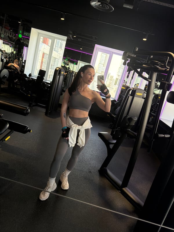 Woman Takes Selfies During Workout Session in Perm