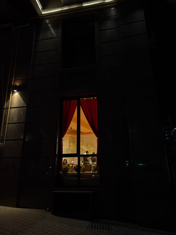 Illuminated building photographed at night in Bishkek, Kyrgyzstan