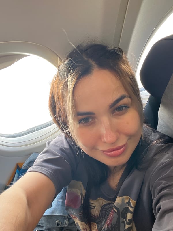 Woman Documents Flight Experience with Selfies and Aerial Views