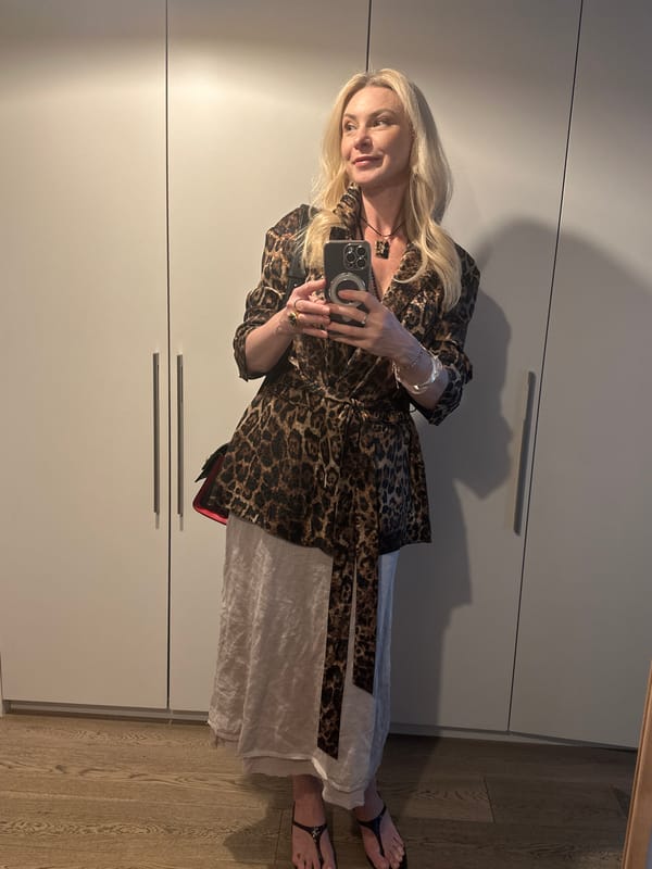 Mirror selfie in a white closet dressing area