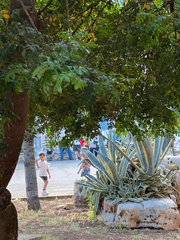 Tourist documents afternoon stroll through historic Bitonto, Italy