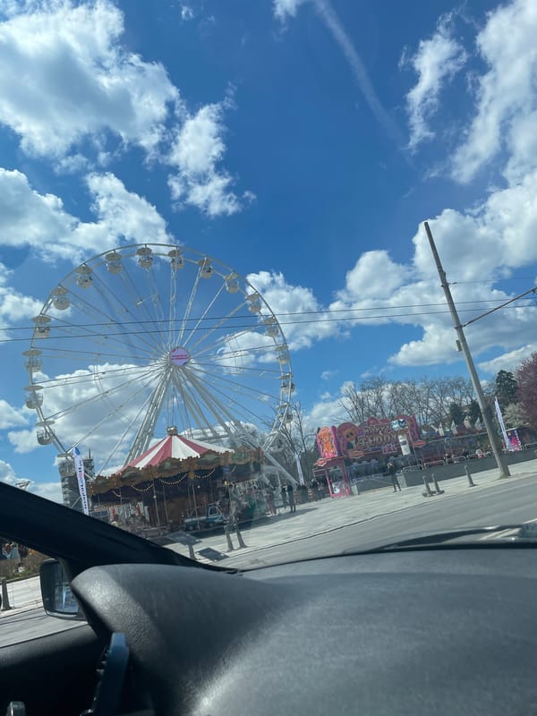 Carnival attractions and historic architecture observed in Sofia