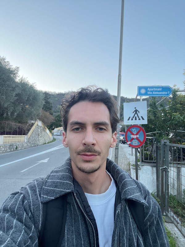 Tourist captures selfie during dawn hours in Budva, Montenegro