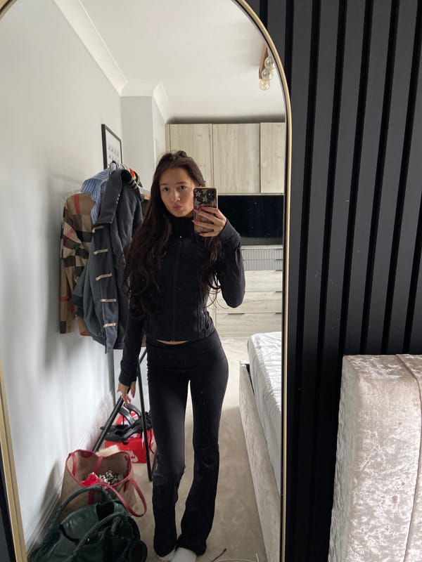 Woman takes morning selfies in bedroom