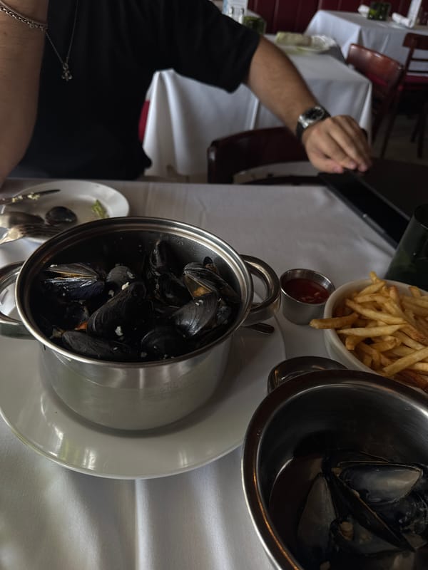 Diner enjoys mussels at Boca Raton restaurant table