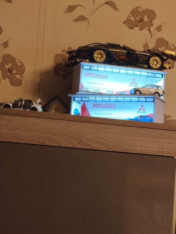 Model cars and Bitcoin coin displayed in Sofia home