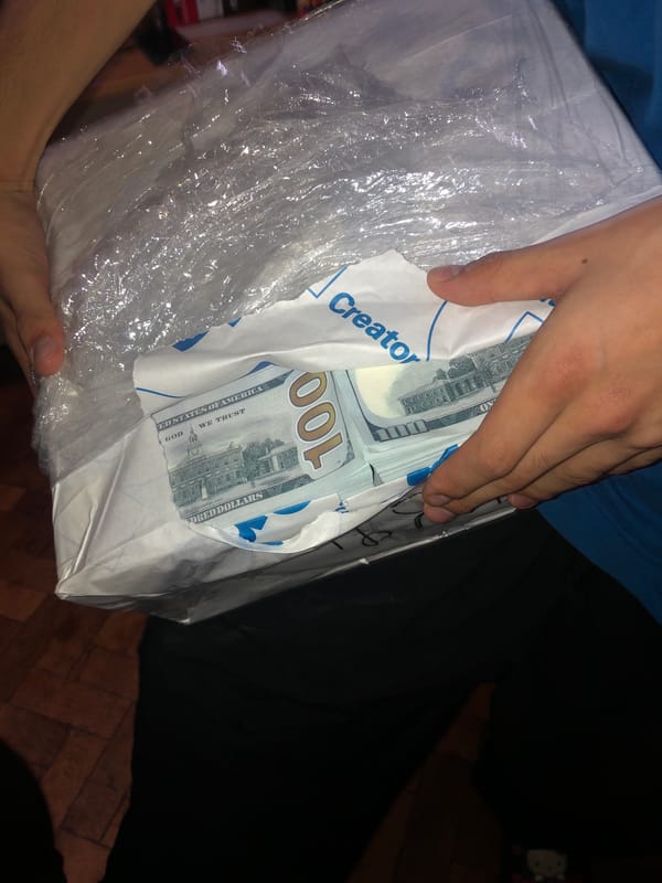 Person handles package of US currency in Buenos Aires