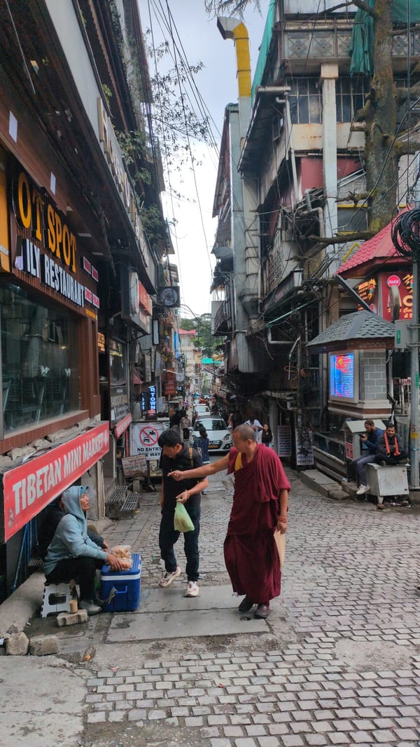 Morning street activity captured in Bhagsu, India alleyway