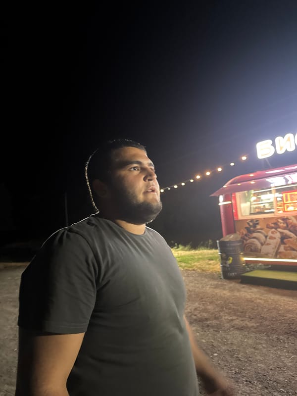 Night gathering around a food truck in Yutin, Russia