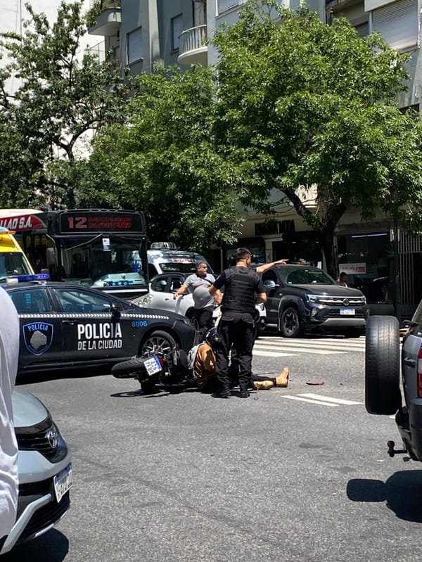 Motorcycle accident attended by police in busy Buenos Aires street