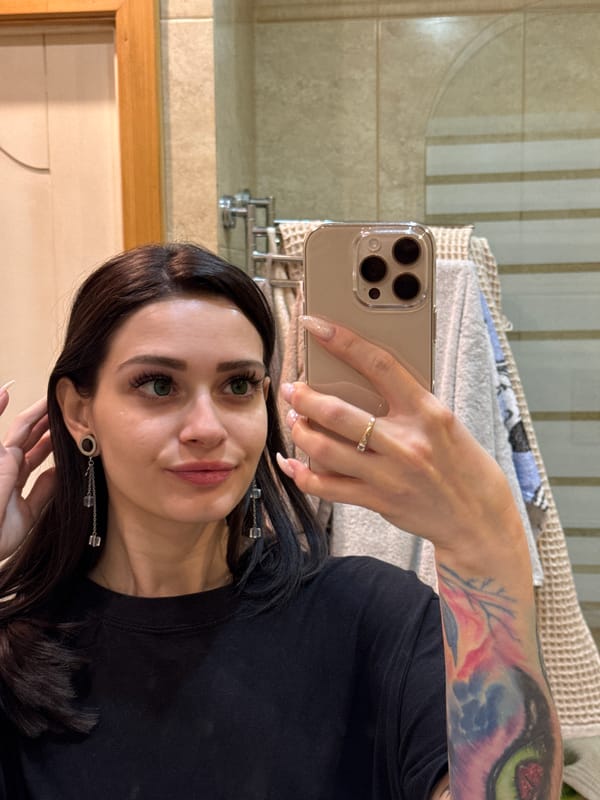 Woman takes selfie, films rainy parking lot in Reutov