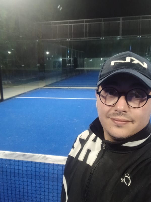 Night padel session captured in selfies at Meknes court