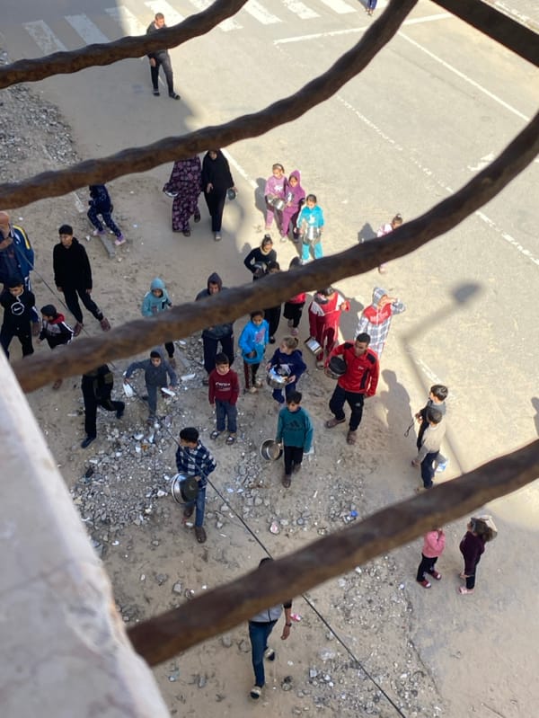 Overhead views show children gathering in Khan Yunis street
