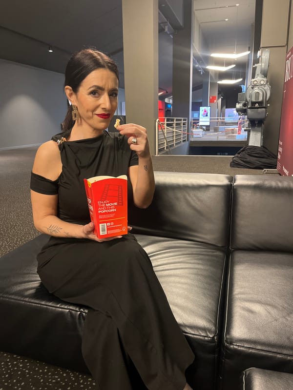 Women enjoy popcorn at Luxembourg cinema during evening visit