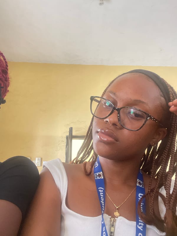Selfie series at University of Jos, student lanyard in frame