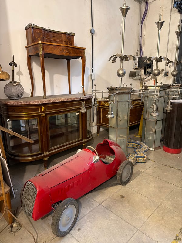 Witness documents cluttered Buenos Aires antique shop interior and exterior