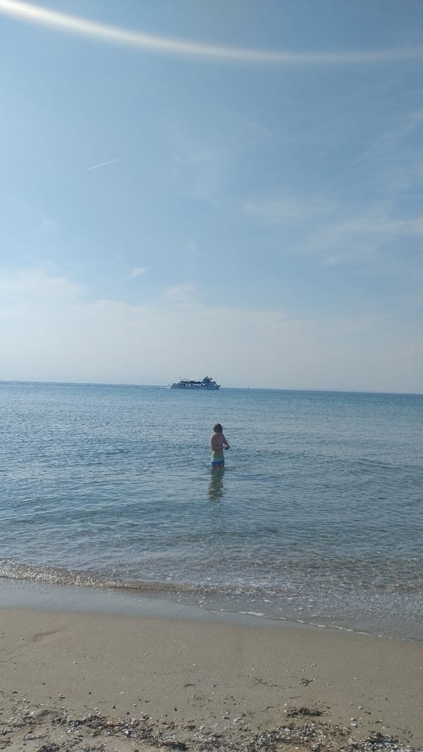 Ordinary beach day documented in Greek coastal towns