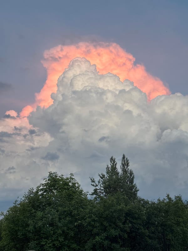 Dramatic sunset illuminates towering clouds at location 666
