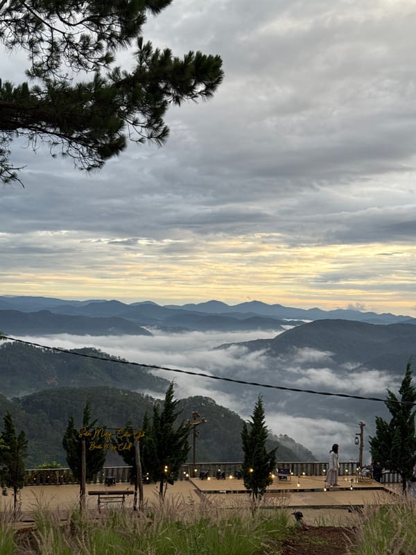 Evening mountain views with wind turbines captured in Phát Chi