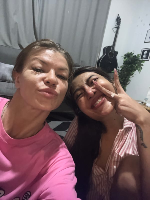 Two women pose for selfie in Kuta, Indonesia