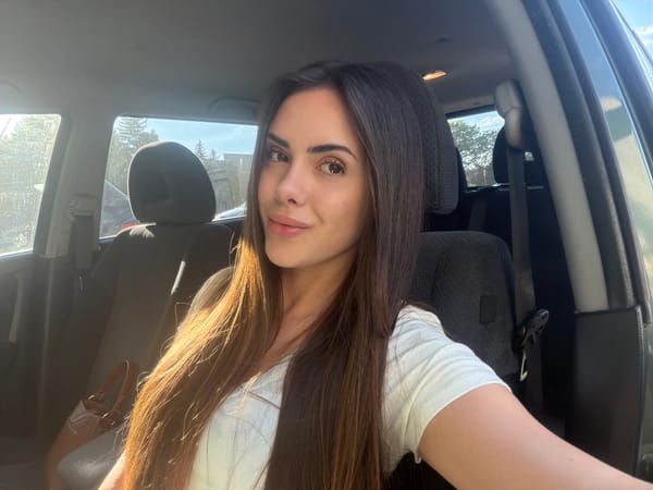 Woman takes selfies in car driver's seat, Sofia